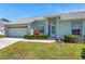 Charming single-story home with a well-manicured lawn and a light-colored exterior at 4301 Avanti Cir, New Port Richey, FL 34655