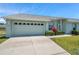 Well-maintained home with a two-car garage, manicured landscaping and a concrete driveway at 4301 Avanti Cir, New Port Richey, FL 34655