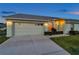 Single Gathering home with well-manicured lawn and an attached two-car garage at 4301 Avanti Cir, New Port Richey, FL 34655