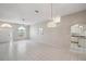 Open living space with tile flooring, bright lighting and an open-concept design at 4301 Avanti Cir, New Port Richey, FL 34655