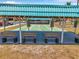 A closer view of the community's shuffleboard courts, showing the benches under the shelter at 4301 Avanti Cir, New Port Richey, FL 34655