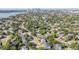 Expansive aerial view showcases lush landscaping and city skyline in the distance from a vibrant neighborhood at 481 W Davis Blvd, Tampa, FL 33606