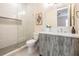 Contemporary bathroom featuring a glass-enclosed shower, stylish vanity, and modern fixtures at 481 W Davis Blvd, Tampa, FL 33606