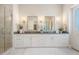 Expansive bathroom with dual sinks, glass shower, and bright white cabinetry at 481 W Davis Blvd, Tampa, FL 33606