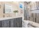 Modern bathroom with a stylish vanity, sleek mirror, and a walk-in shower featuring elegant tile work at 481 W Davis Blvd, Tampa, FL 33606