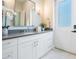 Elegant bathroom boasting a white vanity, walk-in shower, and stylish lighting at 481 W Davis Blvd, Tampa, FL 33606