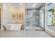 Elegant bathroom featuring a soaking tub, glass-enclosed shower, and luxurious finishes at 481 W Davis Blvd, Tampa, FL 33606
