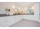 Bright bathroom features double sinks with vanity, gray countertops, and modern lighting fixtures at 481 W Davis Blvd, Tampa, FL 33606