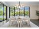 Dining room with views featuring a modern light fixture and large windows at 481 W Davis Blvd, Tampa, FL 33606