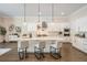 Open kitchen area featuring a center island with bar seating, stainless steel appliances, and modern fixtures at 481 W Davis Blvd, Tampa, FL 33606