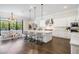 Spacious white kitchen with a large center island, stainless steel appliances, and modern pendant lighting at 481 W Davis Blvd, Tampa, FL 33606