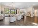 Spacious living room with hardwood floors, modern chandelier, and access to outdoor area at 481 W Davis Blvd, Tampa, FL 33606