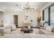 Elegant living room featuring hardwood floors, designer lighting, and comfortable furnishings at 481 W Davis Blvd, Tampa, FL 33606