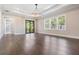 Bright living room featuring wood floors, recessed lights, and sliding door to the balcony at 481 W Davis Blvd, Tampa, FL 33606