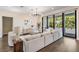 Comfortable living area with hardwood floors, stylish furniture, and a view of the outdoor space at 481 W Davis Blvd, Tampa, FL 33606
