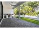 Outdoor kitchen area with stainless steel grill and sink on a brick-paved patio at 481 W Davis Blvd, Tampa, FL 33606
