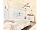 Bedroom features natural light, a ceiling fan, and a tiled floor at 5227 81St Lane N # 26, St Petersburg, FL 33709