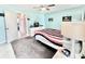 Comfortable bedroom with ceiling fan and view to another room at 5227 81St Lane N # 26, St Petersburg, FL 33709