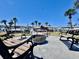 A comfortable common area with palm trees in the background at 5227 81St Lane N # 26, St Petersburg, FL 33709