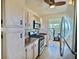 Well-lit kitchen features stainless steel appliances and a ceiling fan at 5227 81St Lane N # 26, St Petersburg, FL 33709