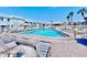 Enjoy the large, sparkling pool with plenty of lounge chairs on a sunny day at 5227 81St Lane N # 26, St Petersburg, FL 33709