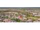 An aerial view of a lovely neighborhood featuring well-maintained homes, lush landscaping, and mature trees at 5310 Sanderling Ridge Dr, Lithia, FL 33547