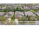 Beautiful home with a well-manicured front yard in a residential neighborhood from an aerial perspective at 5310 Sanderling Ridge Dr, Lithia, FL 33547
