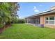 Lush green backyard with mature trees, providing a serene and private outdoor space at 5310 Sanderling Ridge Dr, Lithia, FL 33547