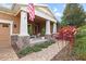 Inviting front porch showcasing stylish columns and stone accents, providing an ideal outdoor living space at 5310 Sanderling Ridge Dr, Lithia, FL 33547