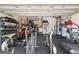 Spacious garage transformed into a home gym with workout equipment and weightlifting gear for fitness enthusiasts at 5310 Sanderling Ridge Dr, Lithia, FL 33547