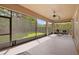 Large screened patio perfect for outdoor relaxation and entertaining, overlooking the lush backyard at 5310 Sanderling Ridge Dr, Lithia, FL 33547