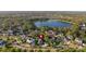 Beautiful aerial view of lakeside community with well-maintained lawns and mature trees at 5903 Nature Ridge Ln, Lithia, FL 33547