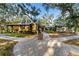 Beautiful club house with walking paths and a sign leading to community amenities at 5903 Nature Ridge Ln, Lithia, FL 33547