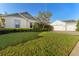 Charming single-Gathering home with a three-car garage, manicured lawn, and inviting curb appeal at 5903 Nature Ridge Ln, Lithia, FL 33547