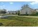 Charming single-story home showcasing a lush green lawn and well-maintained landscaping at 5903 Nature Ridge Ln, Lithia, FL 33547