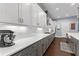 Modern kitchen featuring stainless steel appliances, white subway tile backsplash, and gray and white cabinets at 5903 Nature Ridge Ln, Lithia, FL 33547