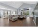 Bright open living room with high ceilings, hardwood floors, and lots of natural light at 5903 Nature Ridge Ln, Lithia, FL 33547