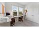Bright office featuring two desks, ample natural light, and neutral décor, perfect for productivity at 5903 Nature Ridge Ln, Lithia, FL 33547