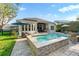 Resort style private pool and spa with outdoor kitchen and beautifully landscaped backyard at 5903 Nature Ridge Ln, Lithia, FL 33547