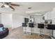 Bright kitchen featuring a breakfast bar, stainless steel appliances, and ample countertop space at 6416 Lomand Ave, New Port Richey, FL 34653