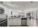 Stylish kitchen with stainless steel appliances, granite countertops, and a view of the living area at 6416 Lomand Ave, New Port Richey, FL 34653