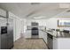 Modern kitchen with stainless steel appliances, ample counter space, and tile flooring at 6416 Lomand Ave, New Port Richey, FL 34653