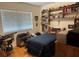 This bedroom features a large window and custom shelving at 6703 Peachtree Dr, Temple Terrace, FL 33617