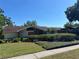 Charming single-story home with a well-manicured lawn and mature trees at 6703 Peachtree Dr, Temple Terrace, FL 33617