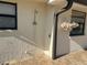 Exterior outdoor shower near flower box at 6703 Peachtree Dr, Temple Terrace, FL 33617