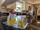 Kitchen counter with lemon decorated pitcher, white cabinets and views to the outdoors at 6703 Peachtree Dr, Temple Terrace, FL 33617