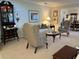 Bright living room with plush carpeting, tasteful furniture, and elegant decor at 6703 Peachtree Dr, Temple Terrace, FL 33617