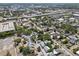 Wide aerial view of a city neighborhood with mature trees and visible highway at 701 14Th N St, St Petersburg, FL 33705
