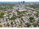 An aerial view captures a neighborhood with a mix of residential and commercial properties and ocean views at 701 14Th N St, St Petersburg, FL 33705