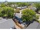 Aerial view of a neighborhood featuring mature trees and manicured lawns and a pergola in the back at 701 14Th N St, St Petersburg, FL 33705